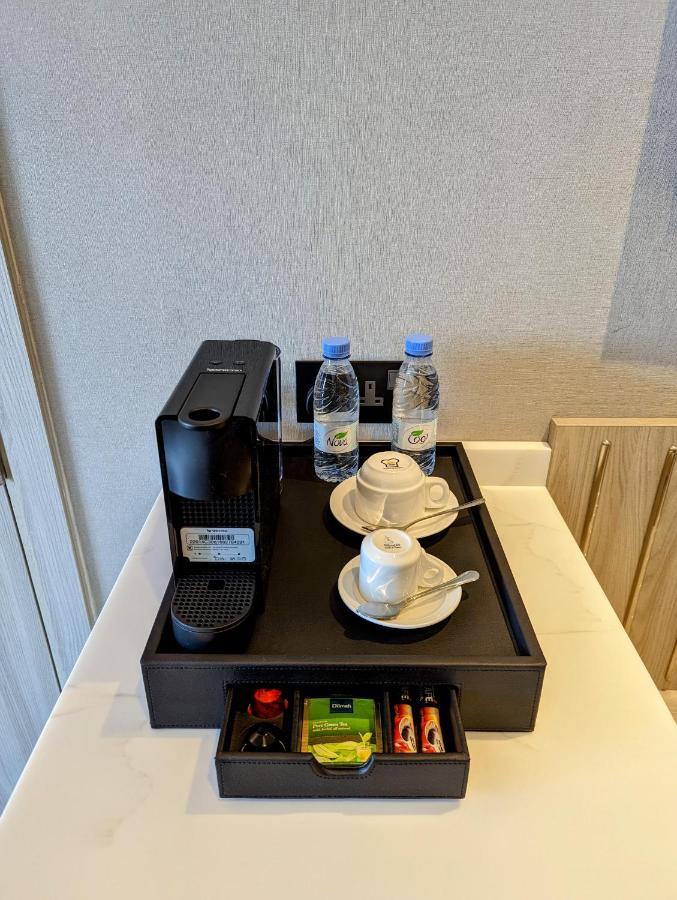 Aparthotel Citadines Abha Exterior foto A Nespresso coffee machine in a hotel room